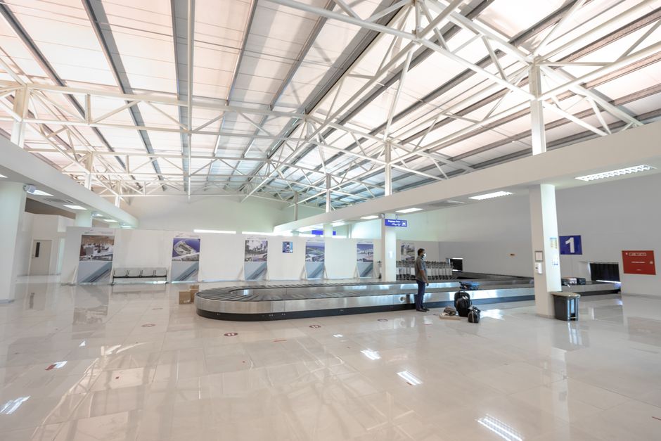 airport arrivals hall with luggage