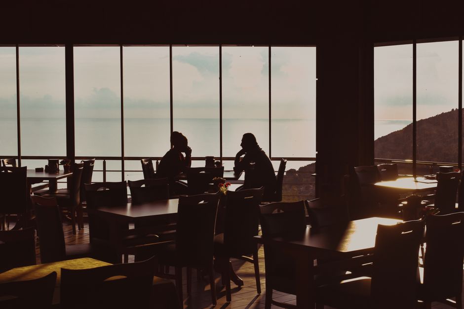 seaside restaurant tables at sunset