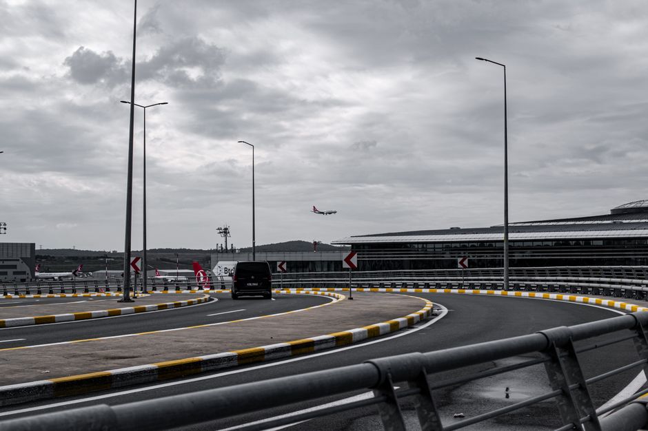 shuttle van parked near airport arrivals