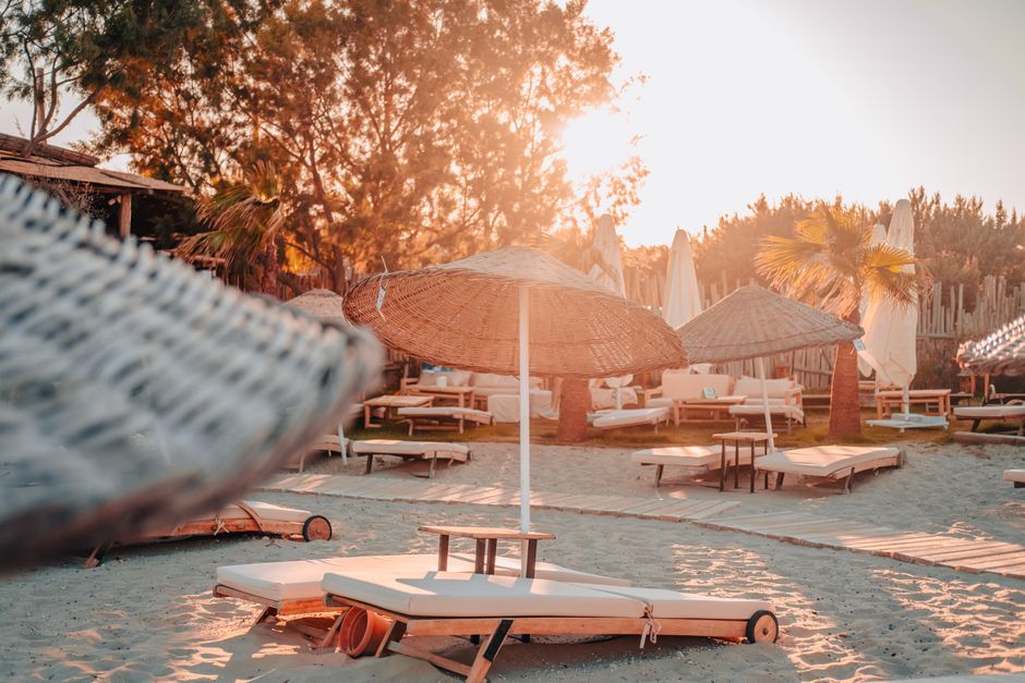 sandy beach with sun loungers in Side