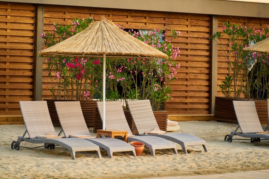 sandy beach with sun loungers in Lara